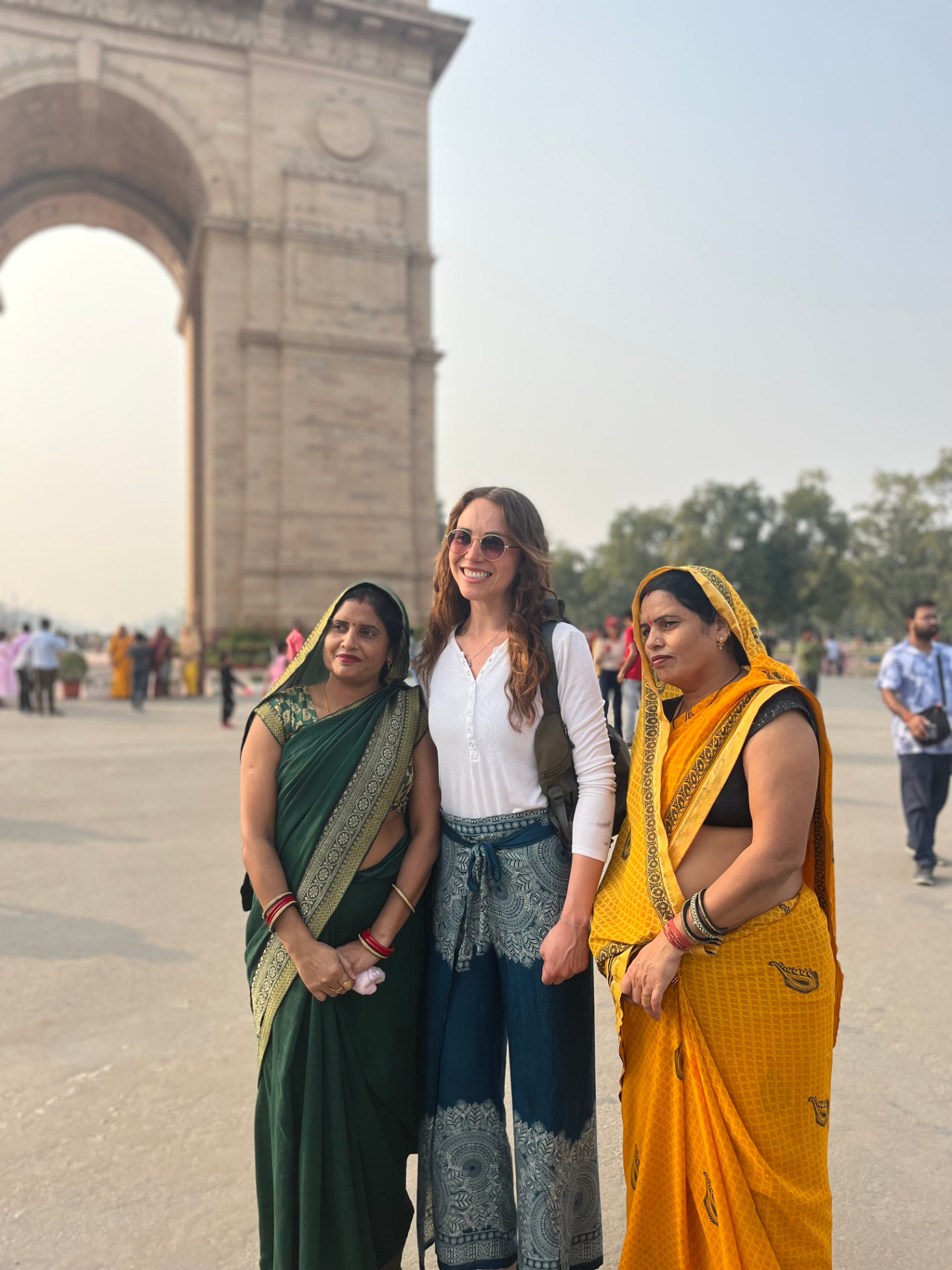 With two local women in saris at India Gate, Delhi